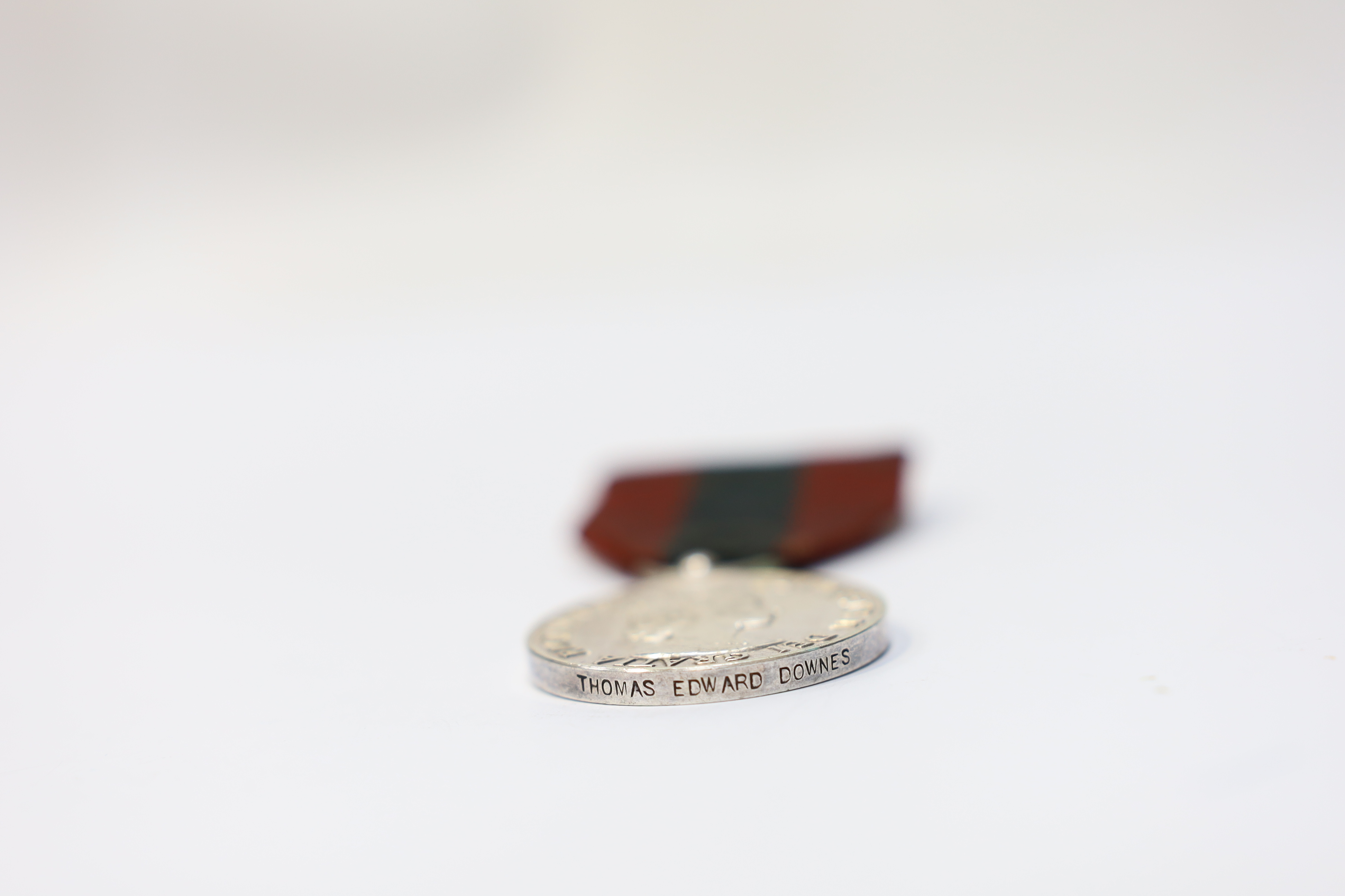 Four assorted Service medals; Vict unnamed Volunteer Long Service medal; GV Colonial Auxiliary Forces Long Service medal (disc only) to E.S.Ware; ERII ISM to Thomas Edward Downes; ERII ISM to William Henry Sharratt. Cond